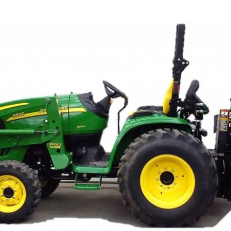 green tractor with attachments